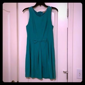 Flirty teal dress with bow detail